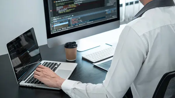 stock image Professional programmer working on website project in software development on the desktop computer, making coding and typing data code password security.