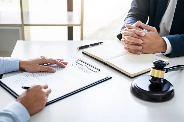 stock image Businesswoman and Male lawyer or judge consult and conference having team meeting with client at law firm in office, Law and Legal services concept.