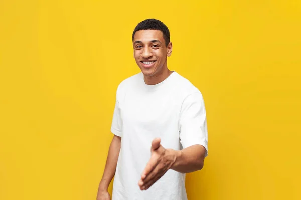 Young Guy African American White Shirt Welcomes Invites Yellow Isolated — Stock Photo, Image