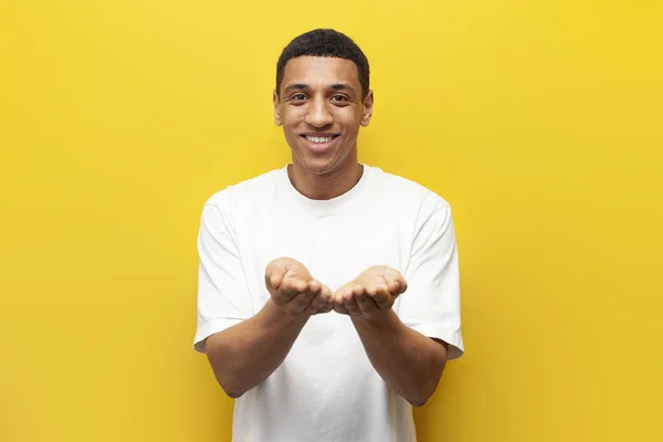 Young African American Guy Holds His Hands Front Him Yellow — Stock Photo, Image