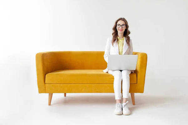 Young Businesswoman Suit Sits Comfortable Soft Sofa Uses Laptop Girl — Stock Photo, Image
