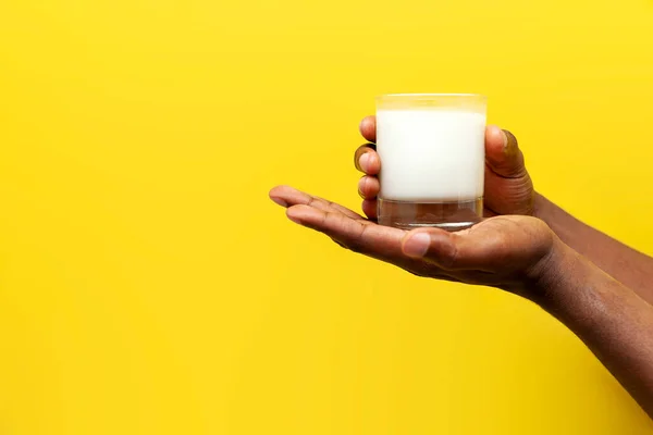 Hands African American Man Hold Glass Milk Yellow Isolated Background — Stock Photo, Image