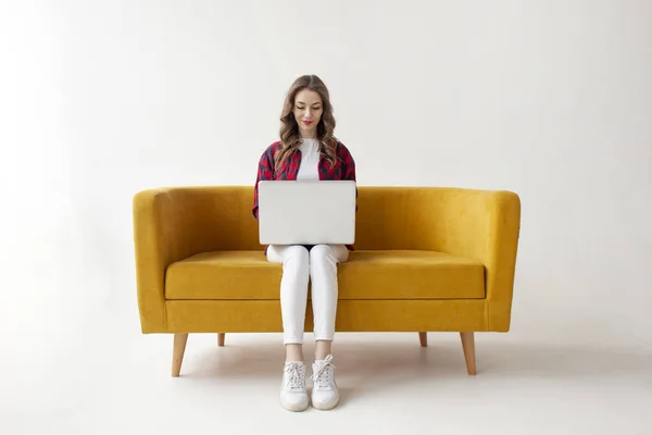 Young Cute Girl Uses Laptop Comfortable Soft Sofa Woman Types — Stock Photo, Image