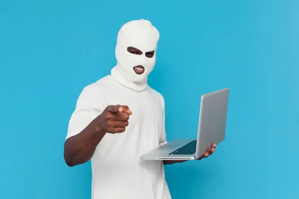 African American Male Hacker White Balaclava Uses Laptop Threatens Blue — Stock Photo, Image
