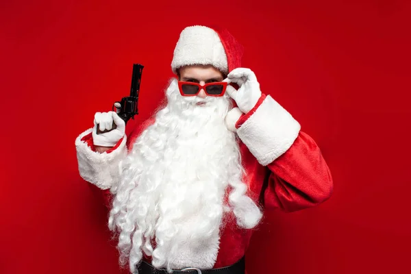 Santa Claus Hat Festive Glasses Holds Gun His Hands Red — Stock Photo, Image