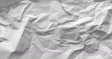 Stop motion animation of wrinkled white paper. Textured paper background. 4K loop animation