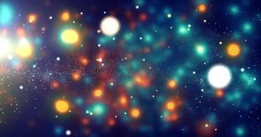 Mavi ve turuncu arkaplan ile küçük parçacıkların bulanık bir görüntüsü. Parçacıklar farklı boyutlarda ve renklerde hareket ve enerji hissi yaratıyorlar. Manzara dinamik ve canlı