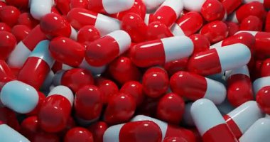 Birbirini iten kırmızı ve beyaz haplar. Haplar kırmızı ve beyaz ve üst üste istiflenmiş. 4K canlandırma canlandırması