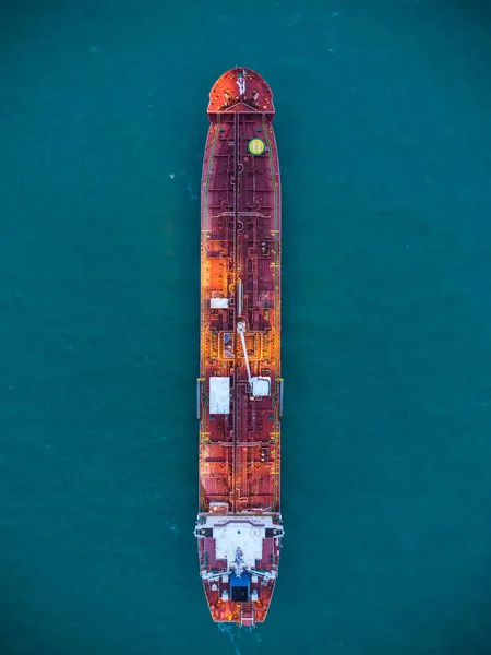 Aerial top view oil ship tanker carrier oil on the sea at sunrise