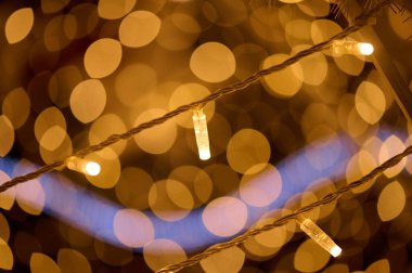 Gold bokeh lights background close-up