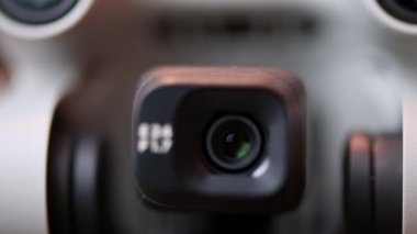 Macro close-up of a digital camera mounted on a drone.