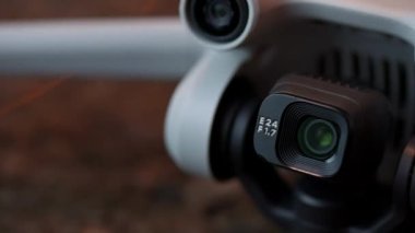 Macro close-up of a digital camera mounted on a drone.
