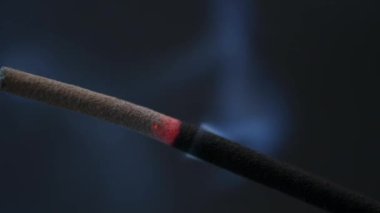 burning incense stick macro close-up