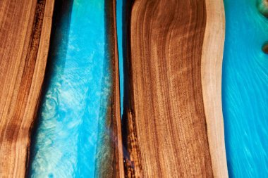 Texture of a wooden table with epoxy resin closeup