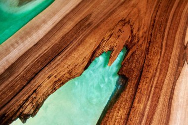 Texture of a wooden table with epoxy resin closeup