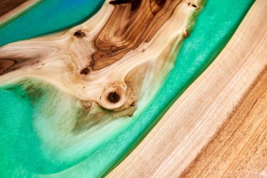Texture of a wooden table with epoxy resin closeup