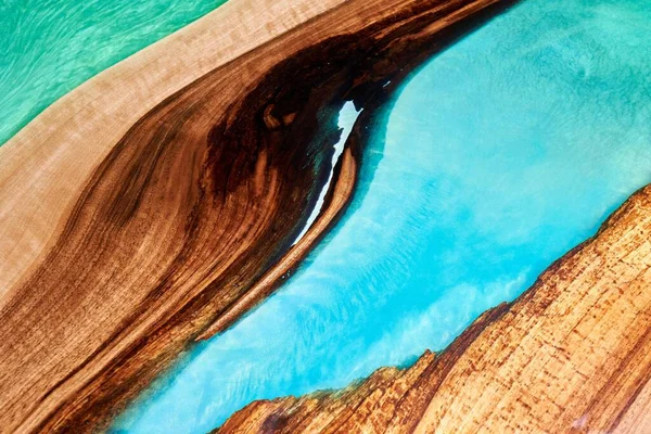 Texture of a wooden table with epoxy resin closeup