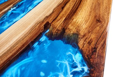Texture of a wooden table with epoxy resin closeup