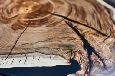 Texture of a wooden table with epoxy resin closeup