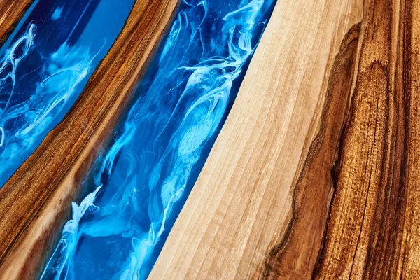 Texture of a wooden table with epoxy resin closeup