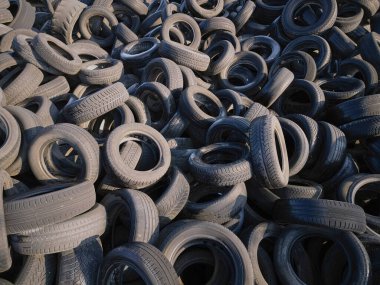 Aerial top down view of old tires. Many car and truck tires on dump site from above clipart