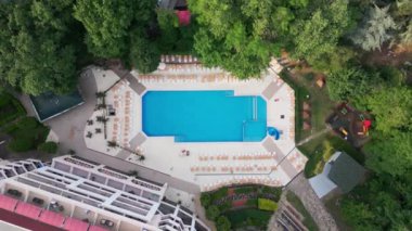 Aerial top view of beautiful luxury outdoor swimming pool in hotel resort