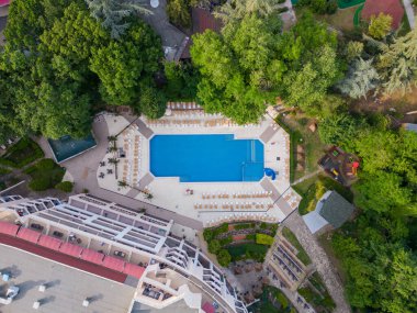 Aerial top view of beautiful luxury outdoor swimming pool in hotel resort