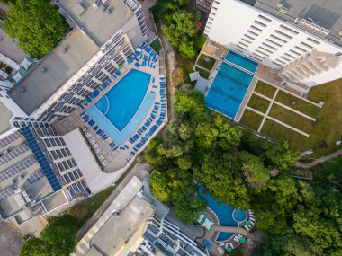 Aerial top view of beautiful luxury outdoor swimming pool in hotel resort