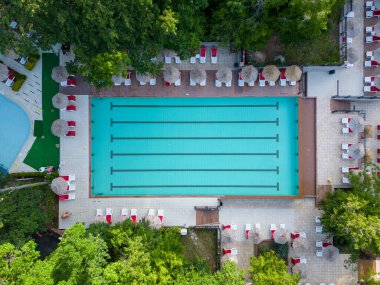 Aerial top view of beautiful luxury outdoor swimming pool in hotel resort