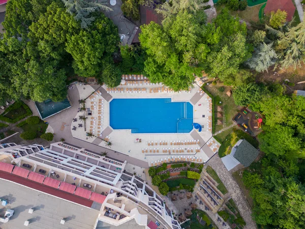 Aerial top view of beautiful luxury outdoor swimming pool in hotel resort