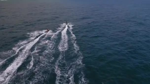 Aerial Top View Personal Watercraft Speeding Waves Creating Mesmerizing Trail — Stock Video
