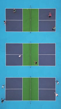 Çoklu Pickleball sahalarının havadan görünüşü, oyuncular iş başında. Güneşli bir günde renkli mavi ve yeşil spor kompleksi. Eğlence aktivitesi ve sağlıklı yaşam tarzı konsepti.