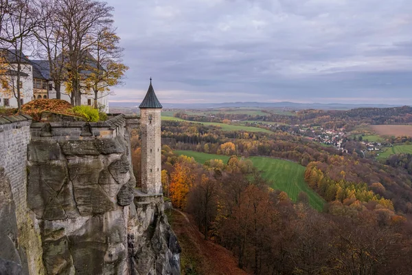 stock image Castle tower on a rock in Saxon Switzerland. Green fields and autumn atmosphere in the background. High quality photo