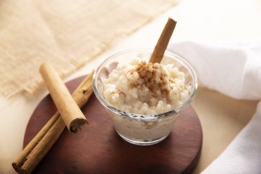 Rice pudding. Sweet dish made by cooking rice in milk and sugar, some recipes include cinnamon, vanilla or other ingredients, it is a very easy dessert to make and very popular all over the world. clipart