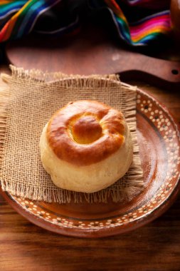 Bisquet. Also known as Bisquets Chinos, it is one of the traditional breads in Mexico, commonly consumed hot, cut in half and spread with butter and fruit jam.