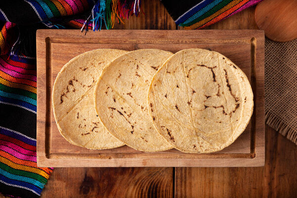 Corn Tortillas. Food made with nixtamalized corn, a staple food in several American countries, an essential element in many Latin American dishes.