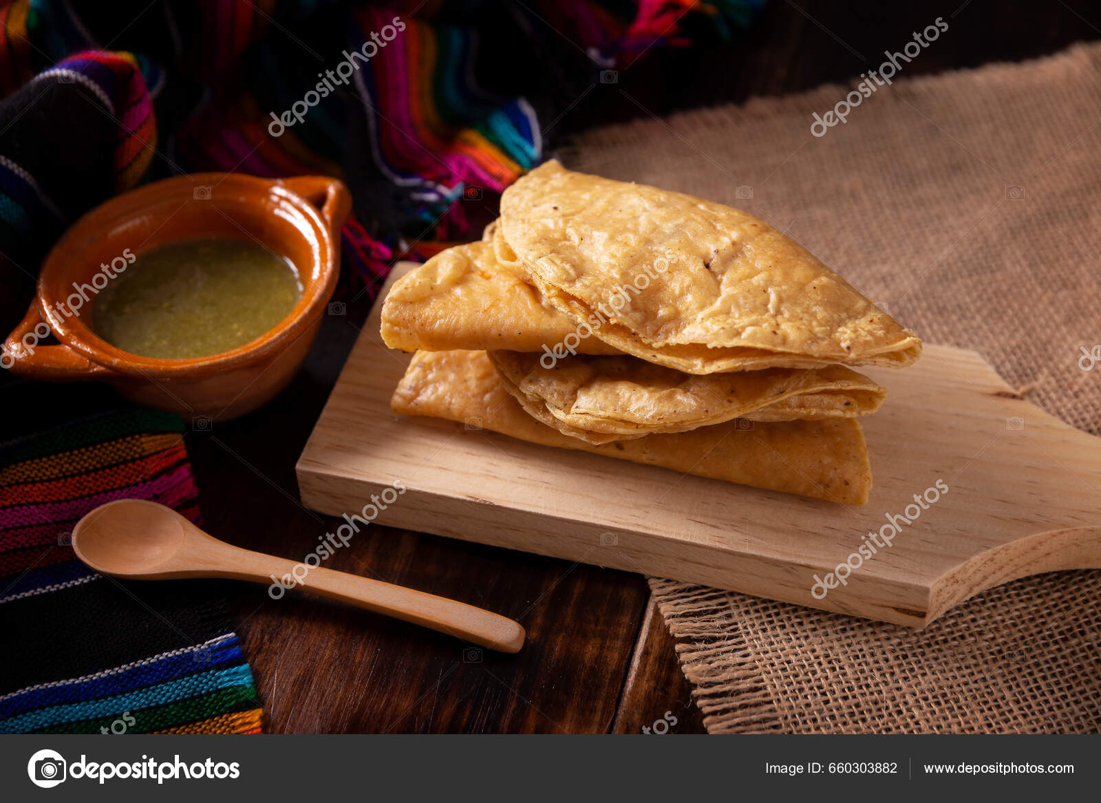 https://st5.depositphotos.com/1257517/66030/i/1600/depositphotos_660303882-stock-photo-golden-quesadillas-fried-quesadillas-made.jpg