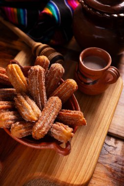 Churros. Fried wheat flour dough, a very popular sweet snack in Spain, Mexico and other countries where it is customary to eat them for breakfast or snack accompanied by hot chocolate or coffee. clipart