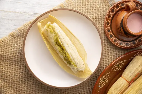 stock image Tamales. hispanic dish typical of Mexico and some Latin American countries. Corn dough wrapped in corn leaves. The tamales are steamed.