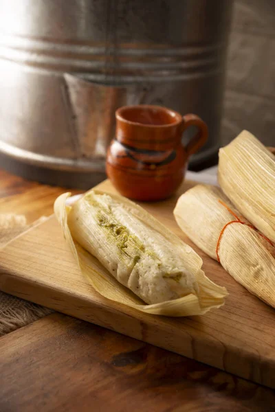 stock image Tamales. hispanic dish typical of Mexico and some Latin American countries. Corn dough wrapped in corn leaves. The tamales are steamed.