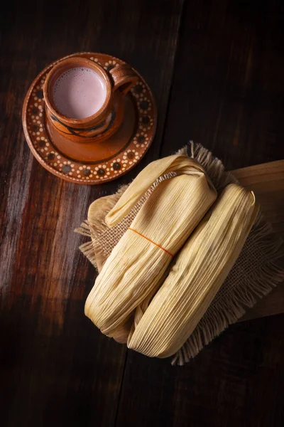 stock image Tamales. hispanic dish typical of Mexico and some Latin American countries. Corn dough wrapped in corn leaves. The tamales are steamed.