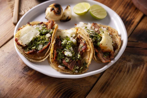 Tacos al pastor. Also known as Tacos de Trompo, they are the most popular type of street tacos in Mexico, commonly made with pork and beef marinated with achiote.