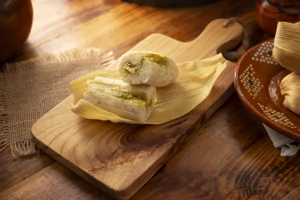 stock image Tamales. hispanic dish typical of Mexico and some Latin American countries. Corn dough wrapped in corn leaves. The tamales are steamed.