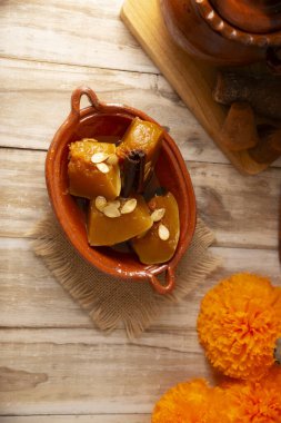 Calabaza en Tacha. Spiced Candied Pumpkin. Mexican dessert whose main ingredients are pumpkin and piloncillo, also known as Chacualole or Calabaza en dulce, widely used in Day of the Dead offerings. clipart