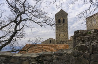 Buildings and churches of Nekresi monastery, Georgia. Orange tiles, stone walls clipart