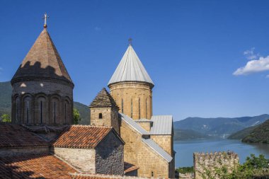 Jinvali Water Reservoir and churches at Ananuri castle complex. Georgia clipart