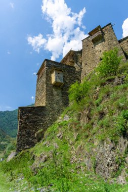 Wooden balconies and stone towers of the medieval village of Shatili clipart