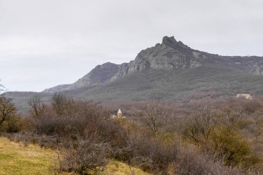 Dome of 40 Sebastian monastery and Azeula fortress on the rock. Spring colors. clipart