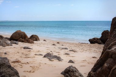 Captured on a sunny day with clear skies and no people in sight, the image conveys a serene and untouched natural landscape, ideal for travel, nature, and relaxation-themed projects.