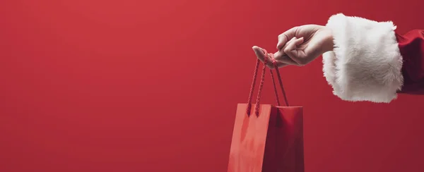 Χριστουγεννιάτικα Ψώνια Και Πώληση Άγιος Βασίλης Κρατώντας Μια Κόκκινη Τσάντα — Φωτογραφία Αρχείου